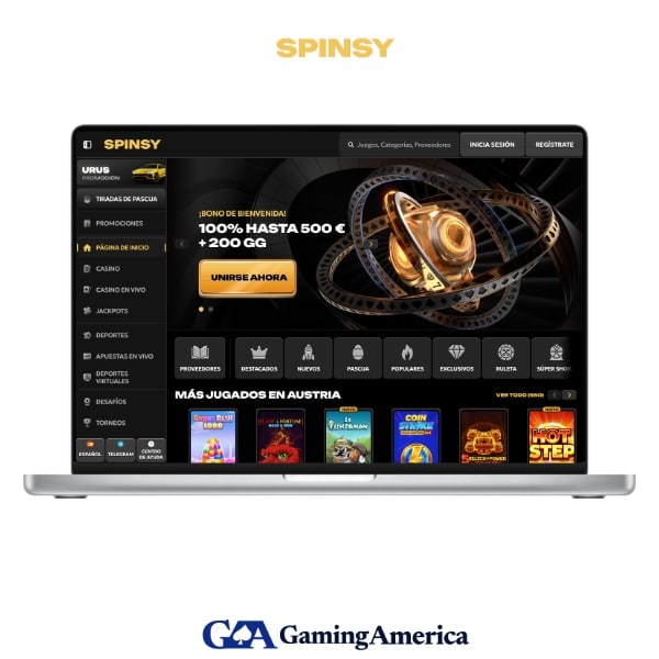 Interfaz de Spinsy Casino mostrando slots y menú de navegación en un ordenador portátil