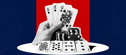 a person holding three cards with four open cards on the table, with a stack of chips in between