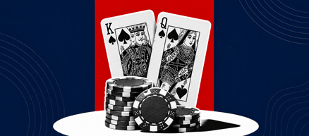 Two high cards behind a chip stack