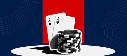 Two playing cards in front of a stack of chips